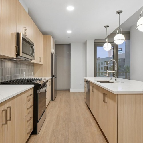 a kitchen with wooden cabinets