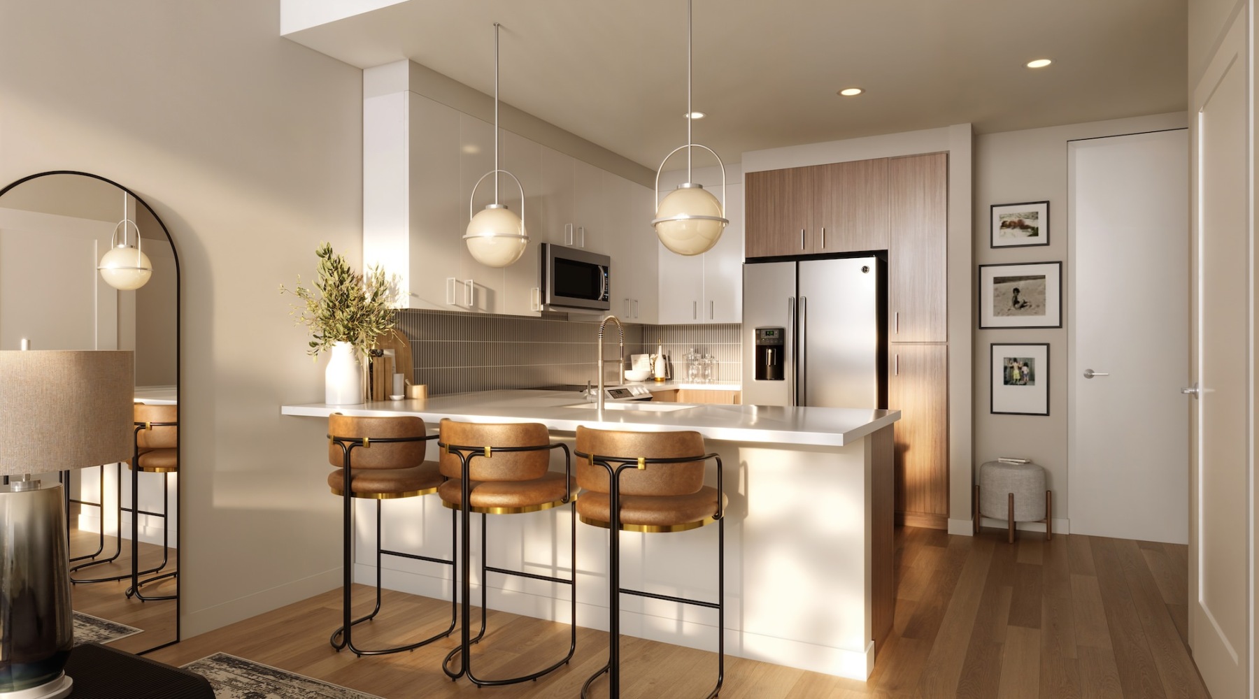 a kitchen with a bar and stools