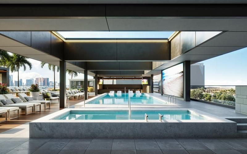 a swimming pool with a building in the background