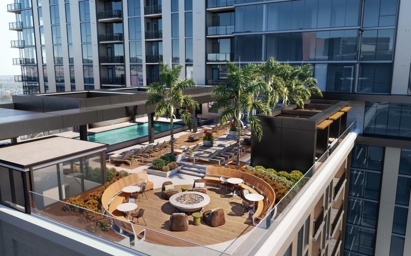 a pool and chairs outside a building